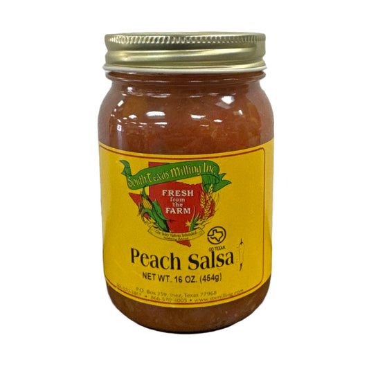 A jar of Peach Salsa with a yellow label on a dark surface, with a white and textured background.