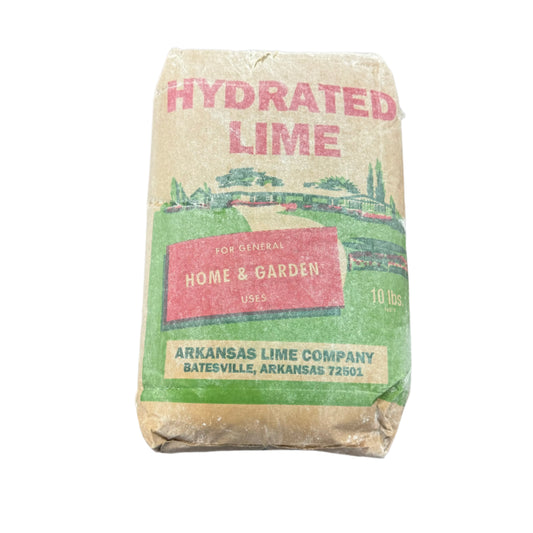 Bag of hydrated lime from Arkansas Lime Company on a rusty surface